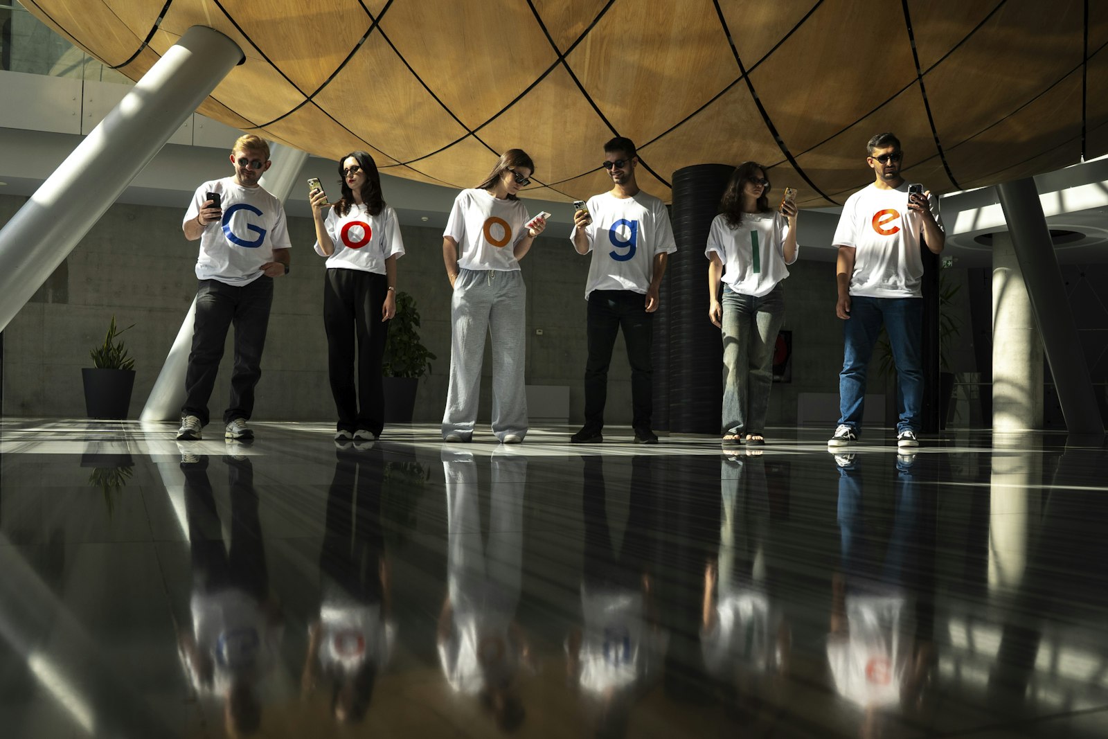 Google team members wearing Google-branded shirts at a company campus